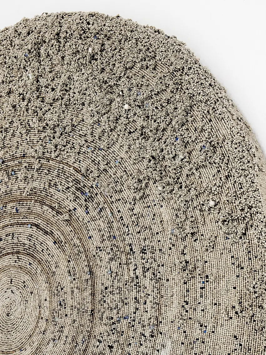 Detail of Nkanyezi showing thousands of individually set glass beads in concentric spirals