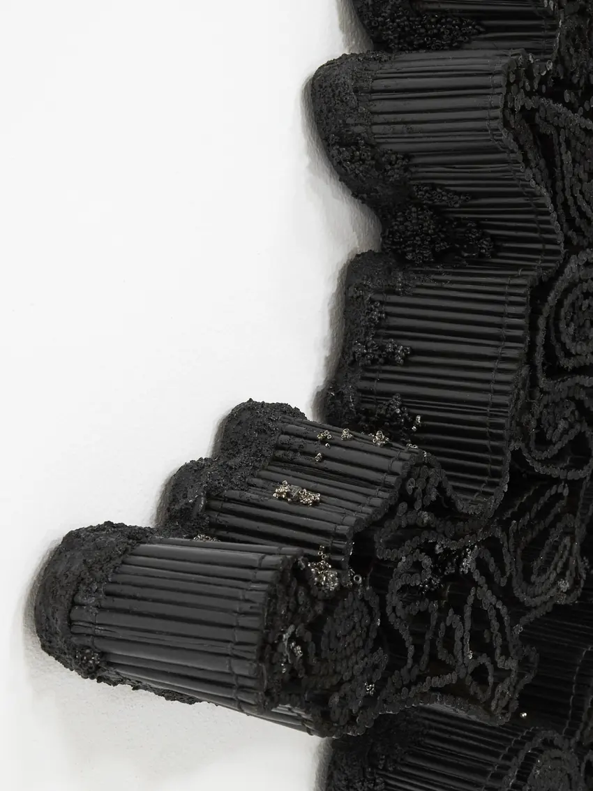 Detail of Ntuthu showing bundled black bugle beads resembling charred reeds